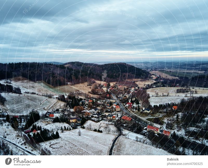 Winter landscape with mvillage near mountains winter aerial nature forest snow road outdoor view trip countryside travel high scenic above beautiful journey