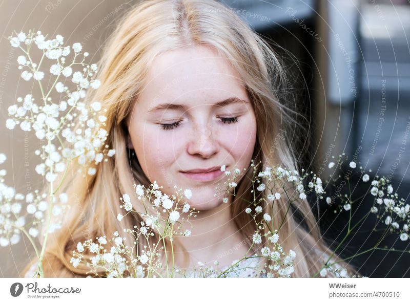 The girl closes her eyes and enjoys the breeze of spring amidst gypsophila pretty Woman youthful Dream Smiling Plant Flower White Baby's-breath cloud Wind