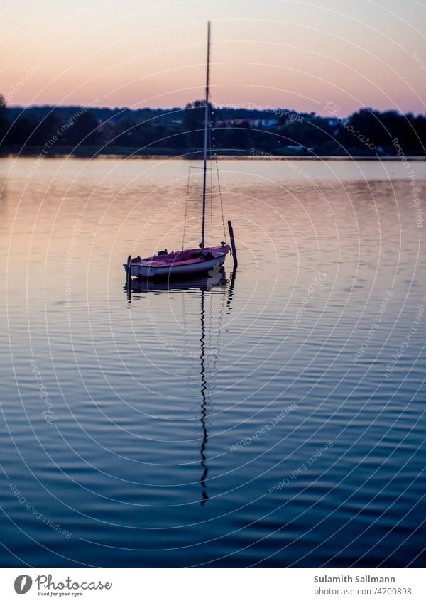 Boat at dusk on a calm lake boat Watercraft Motor barge tranquillity silent Peaceful peace Comforting Sailboat Dusk end of day quiet in the evening Relaxation
