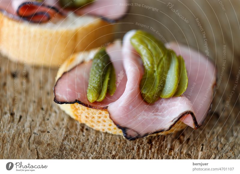 Ham sandwich with cucumber on wood Bread Wood Cucumber Fresh Slice Eating Lettuce tomatoes Lunch Meat salubriously Delicious White Snack Breakfast toast Gherkin