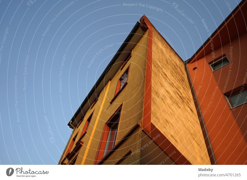 Facade of a residential building in beige and natural colors in the light of the evening sun in the evening in the Bornheim district of Frankfurt am Main in the German state of Hesse