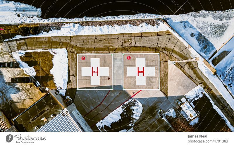 Old hospital landing pad with no helicotopers around the area flat medicine landscape winter season old emergency day cold temperature medevac sign snow urgent