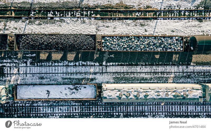 Aerial of resources on the train yard cargo container train track shunting yard city mineral snow united states atmospheric mood transportation railway business