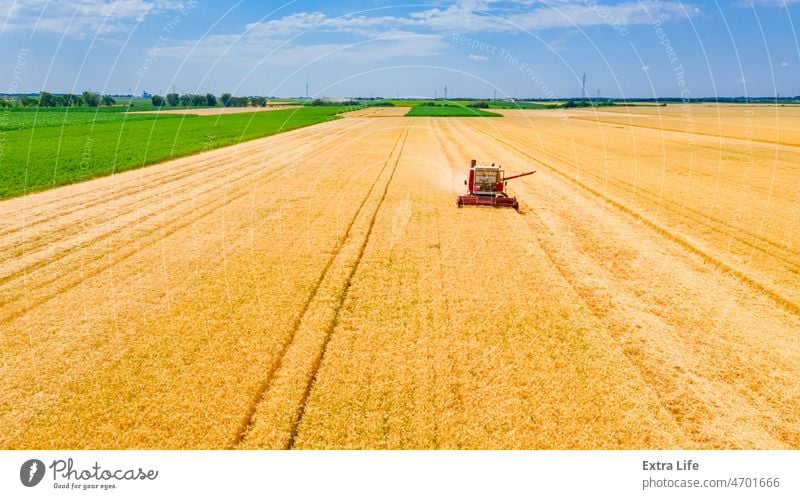 Above view on obsolete combine, harvester machine, harvest ripe cereal Agricultural Agriculture Cereal Combine Country Countryside Crop Cut Dry Farm Farmer