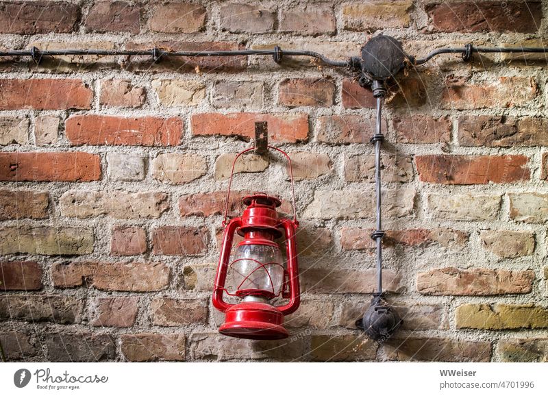 Two ways to turn on light: an old electric switch and a lantern with handle Light stream Electricity Switch on Provision Electrics Lamp Lantern plaster