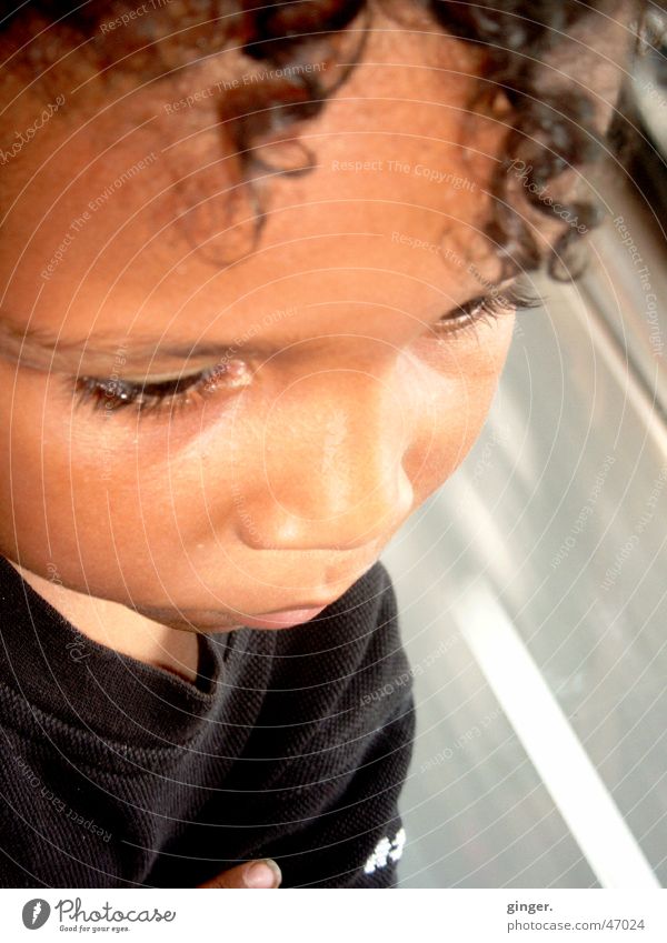 I think - I'm thinking Child Street Think Speed In transit Colour photo Looking Portrait photograph Face of a child Caution Road traffic Blur Curl Africans Nose