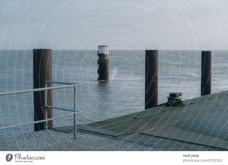 Graphic looking horizon line with bollards and harbor quay Ocean Harbour Bollard Horizon graphically Line Minimalistic SeaCoast North Sea Gray Landscape Nature