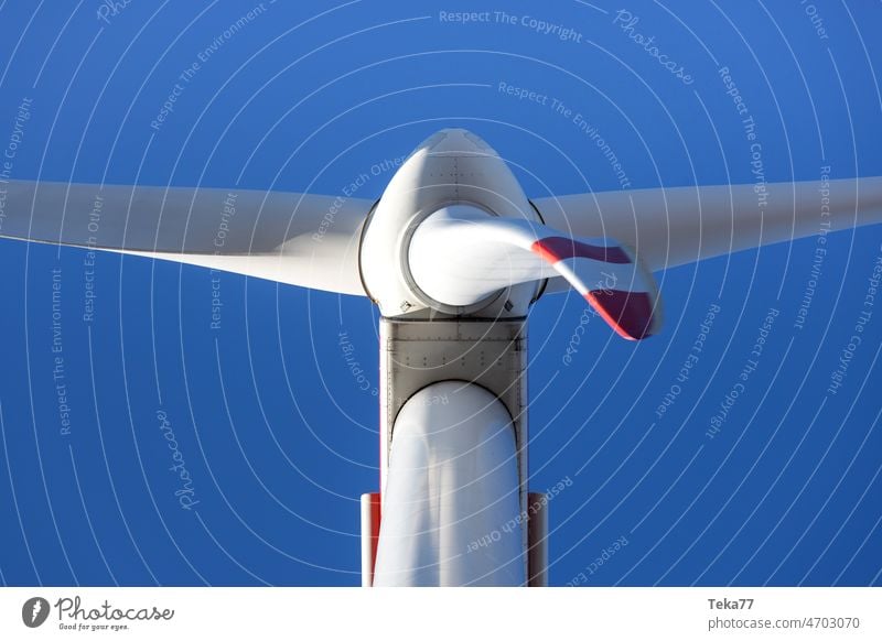 a wind turbine straight from below up wind power wind energy modern wind turbine sky green energy white blue shadow volt amper cable energy cable high voltage