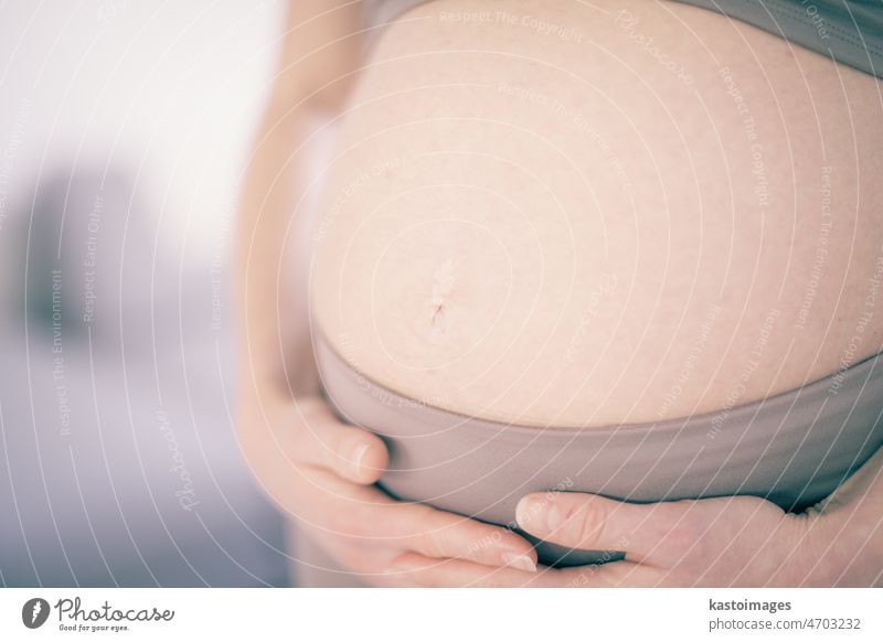 Pregnant woman belly. Pregnancy Concept. Pregnant tummy close up. Detail of pregnant woman relaxed at home. pregnancy love female beautiful expectant expecting