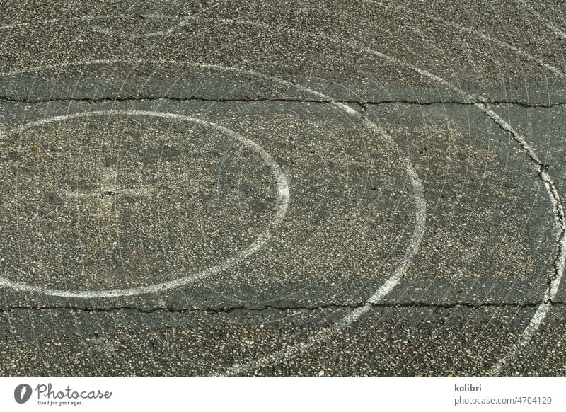 White circular markings on asphalt with two horizontal parallel cracks Street Asphalt circularly Circle detail Gray Line waypoint Lane markings Orientation