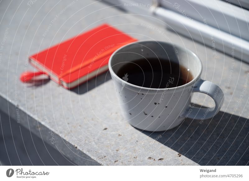 Cup with notebook concept Idea creatively Tea Break Red Gray startup Meditation right in the middle everyday life