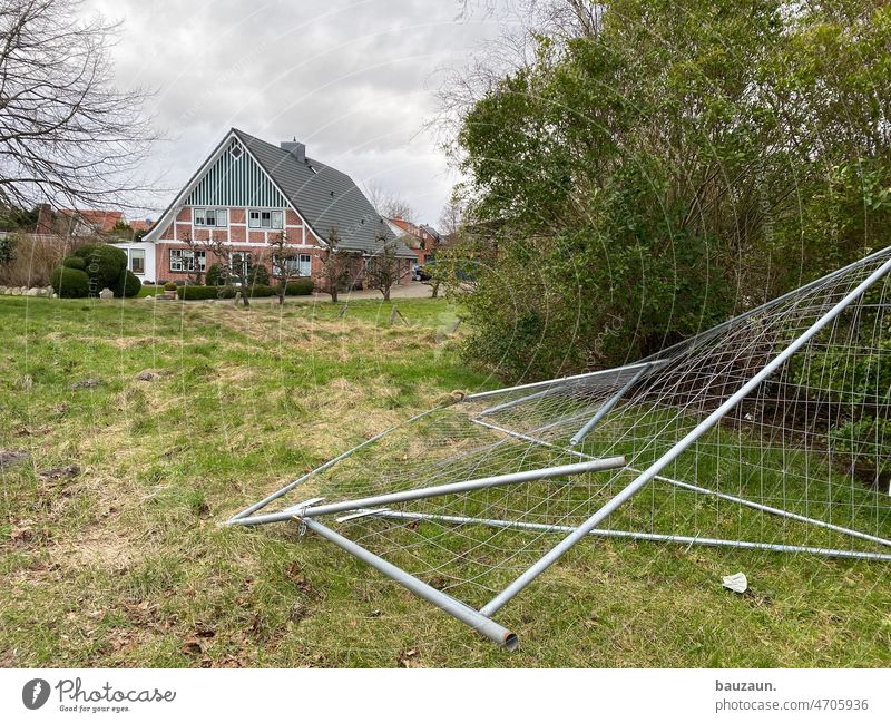 construction fence knocked it out. Hoarding Tree House (Residential Structure) Lawn Northern Germany Landscape Sky cloudy Construction site Exterior shot