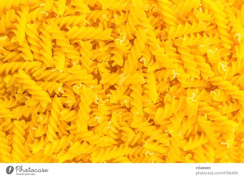 Spiral pasta fussili background texture diet Nutrition eat durum wheat egg noodles Italian Italy carbohydrates food vegetarian raw dough uncooked spaghetti