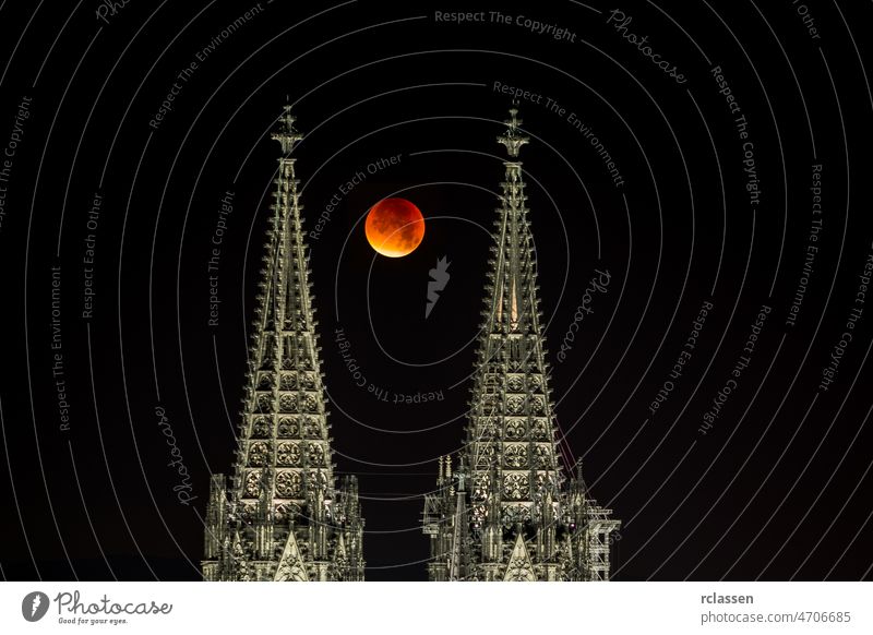 Blood moon between Cologne cathedral tops city Cologne Cathedral Germany Carnival Kölsch church evening Cgothik tourism night landmark lights