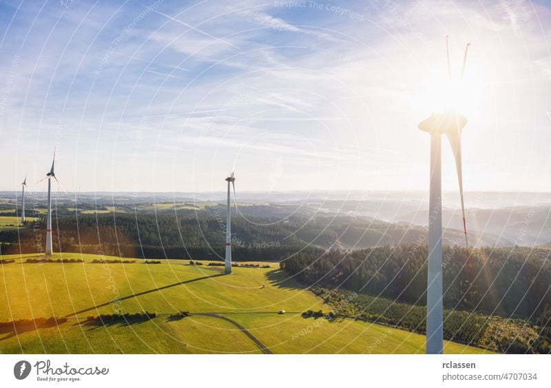 Wind turbines farm and Landscape on a summer day - Energy Production with clean and Renewable Energy - aerial drone shot wind energy power environment fuel