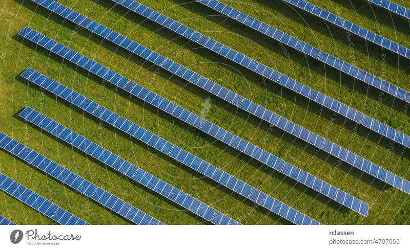 Aerial top down photo of solar panels PV modules mounted on ground photovoltaic solar panels absorb sunlight as a source of energy to generate electricity creating sustainable energy