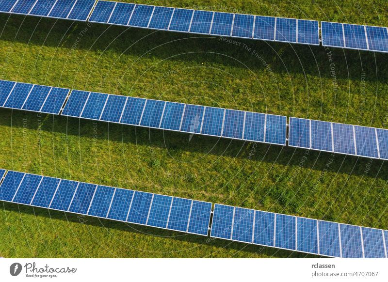 Solar energy farm. High angle view of solar panels on an energy farm aerial field drone power sustainable environmental plant sun wind ecosystem industry