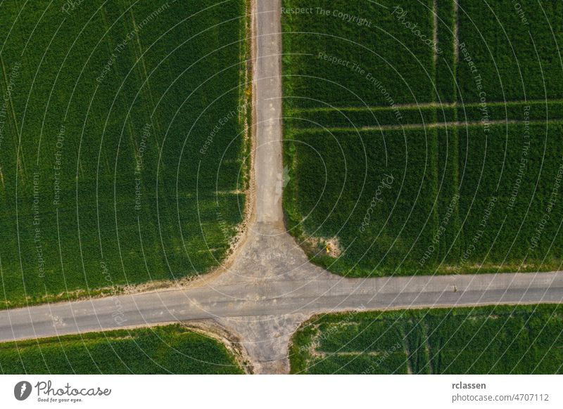 4 ways Traffic Junction in a agriculture field junction aerial cross road view four circular above architecture arrow background. bright business car city day