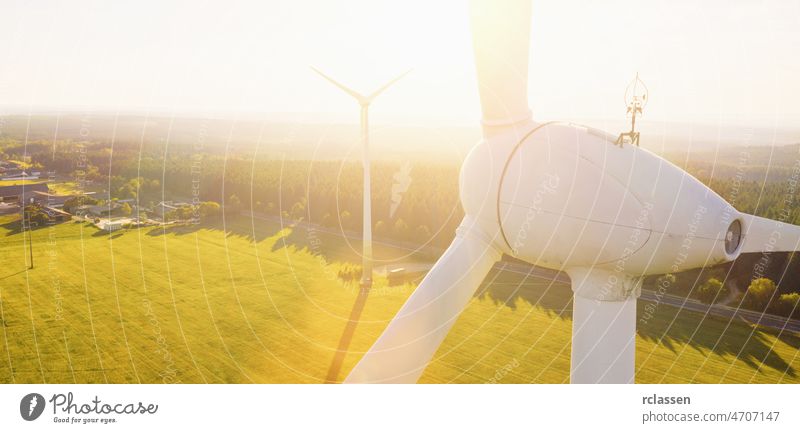 Wind turbines and agricultural fields on a summer day - Energy Production with clean and Renewable Energy - aerial shot, copyspace for your individual text wind