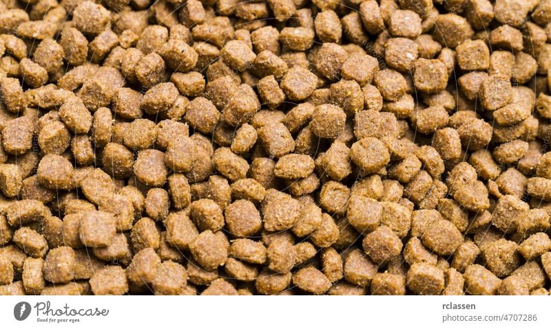 Dry cat food used as background dry protein fresh dish animal pet food backdrop bamboo breakfast brown chicken pussy kitten closeup pile cooking crisp crunchy
