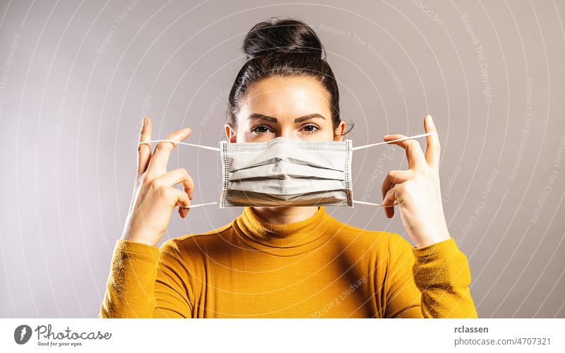 Woman wearing an anti virus protection mask to prevent others from corona COVID-19 and SARS cov 2 infection coronavirus pandemic cov-2 covid covid 19 covid-19