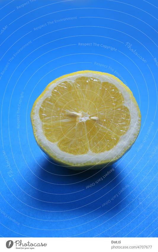 blue yellow lemon Blue Yellow Lemon halved Sliced Fresh fruit Portrait format Copy Space top Fruit Food Nutrition Healthy Healthy Eating Vegetarian diet