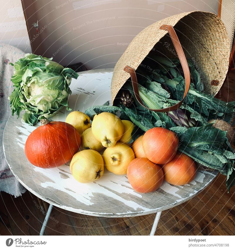 Vegetables and fruits in a basket on a table Mangold Basket Wooden table Pumpkin quince Grapefruit Yellow Orange Green Bright red