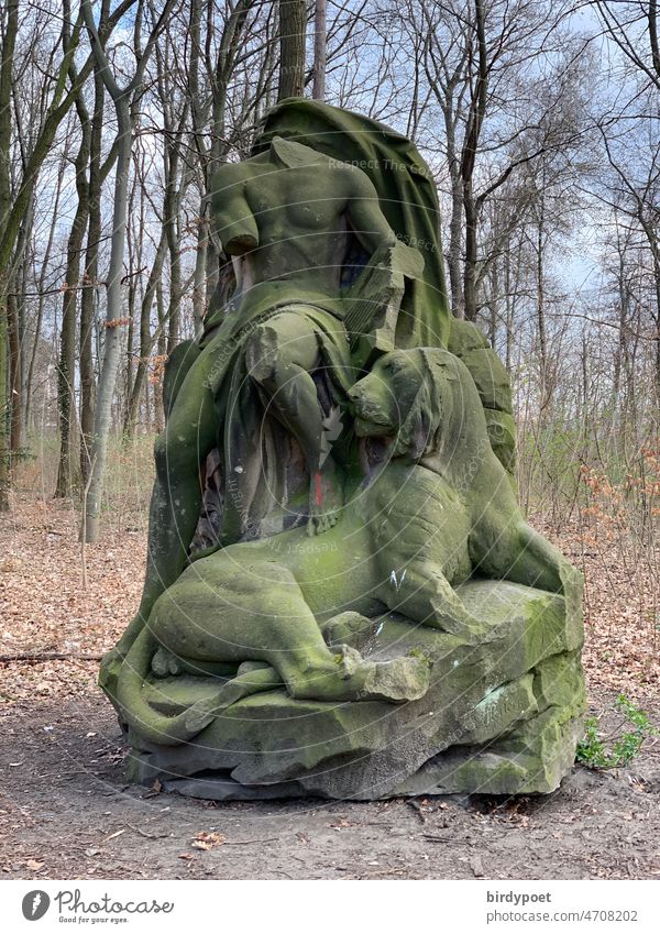 Male statue with lion antiwar monument in forest Forest Anti-war Lion Statue