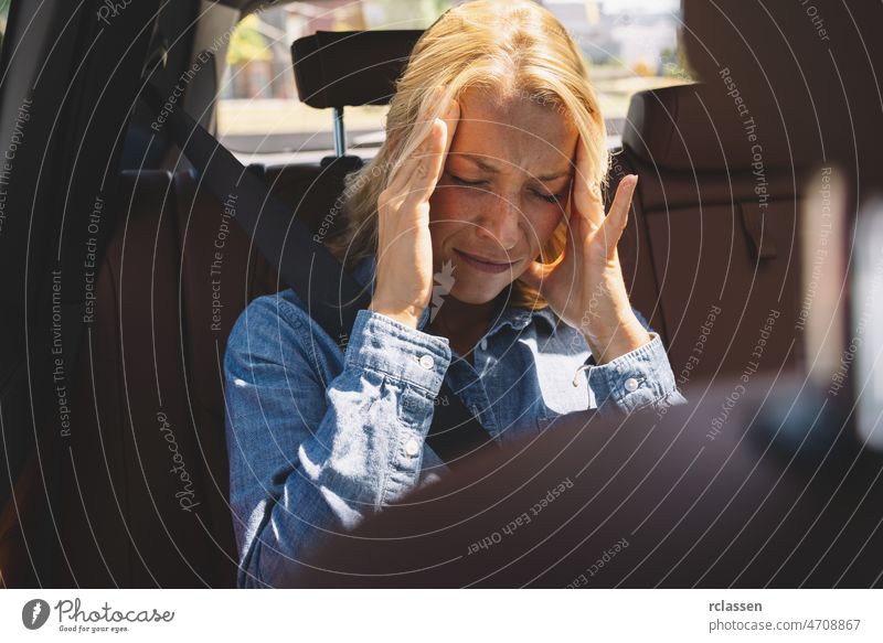 Business woman having headache and has to make a stop after conference or office work. Exhausted, overworked, burnout concept image. stress car drive driver