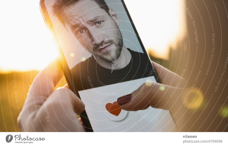 Dating app in mobile phone screen. Woman swiping and liking profiles on relationship site or application. Single woman using smartphone to find love, partner and boyfriend. Mockup website.