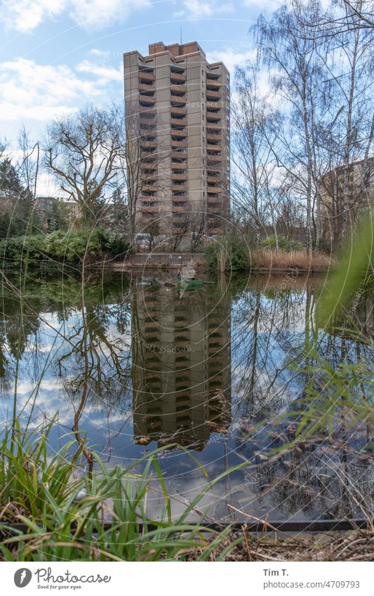 a GDR prefabricated building is reflected in the pond Prefab construction Winter Prenzlauer Berg Berlin Town Exterior shot Capital city Downtown Deserted Pond