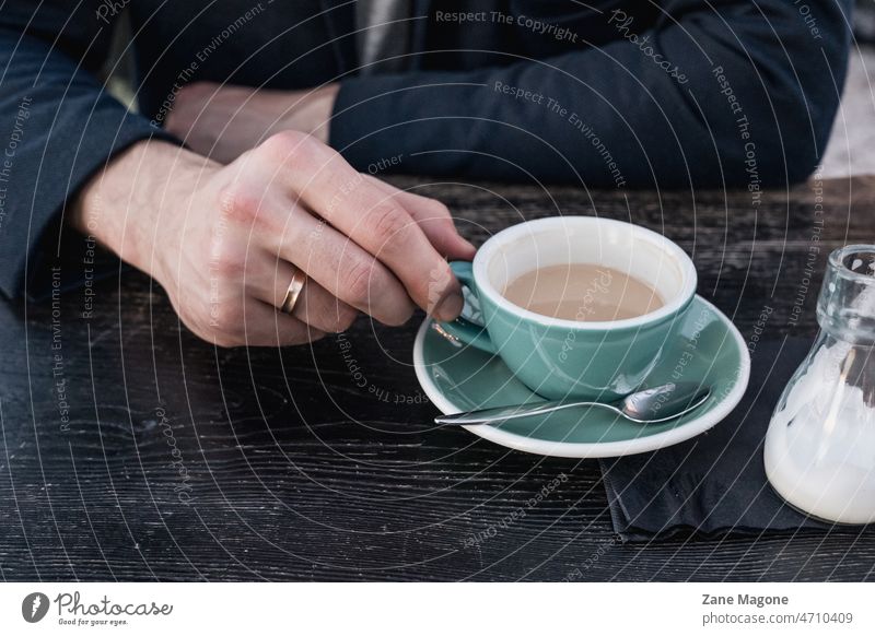 Married man drinking coffee Drinking Man To have a coffee Coffee break Coffee cup Colour photo Café married Coffee table Coffee mug Espresso hand ring Table