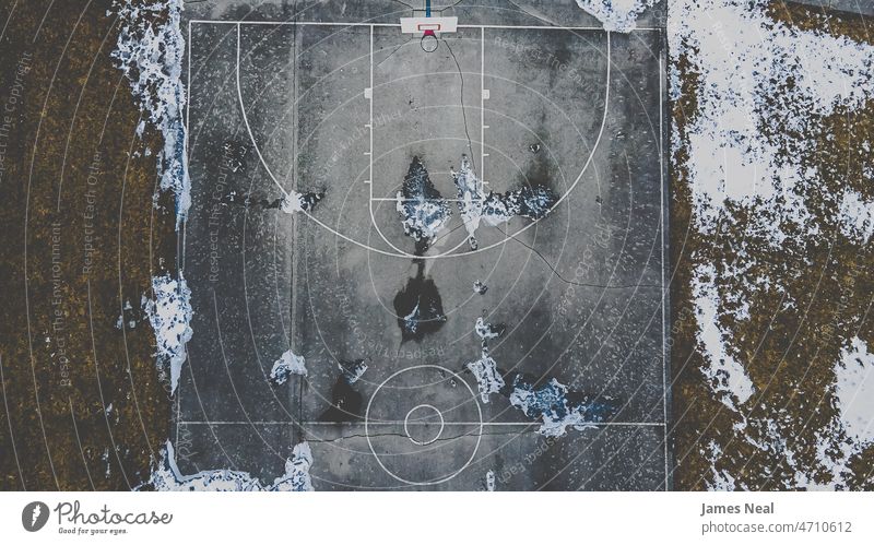 Snow covered park with basketball court spring tranquility excericse frost leisure activity old fashioned cold temperature tranquil scene united states field