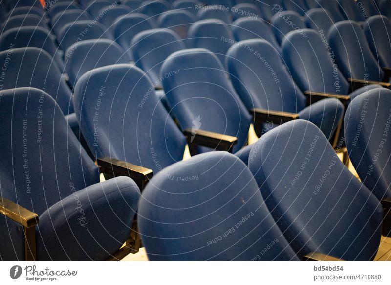 Seats are blue. Interior details. Chairs in cinema. chair seat interior premiere audience auditorium comfortable entertainment film hall indoor performance row