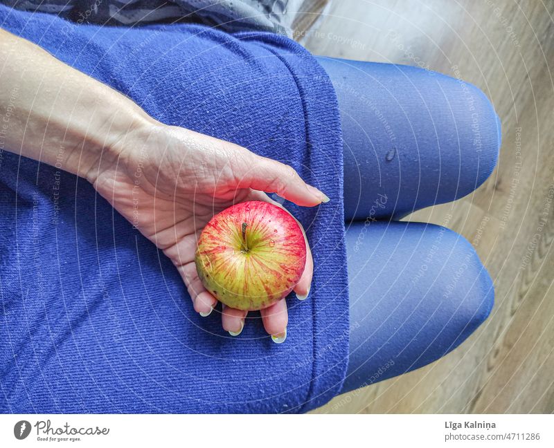 High angle view of woman holding apple in hand Apple Fruit Food Nutrition Vegetarian diet Fresh Organic produce Colour photo Healthy Diet Delicious Red