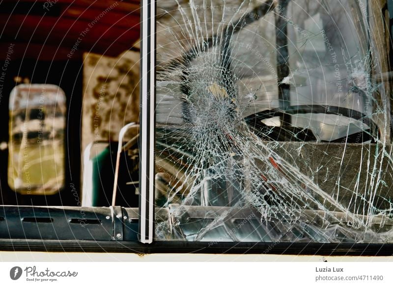 Parked on the side of the road: an old bus with a shattered windshield. Old left forsake sb./sth. Broken Splinter Glass Force Destruction Window Transience