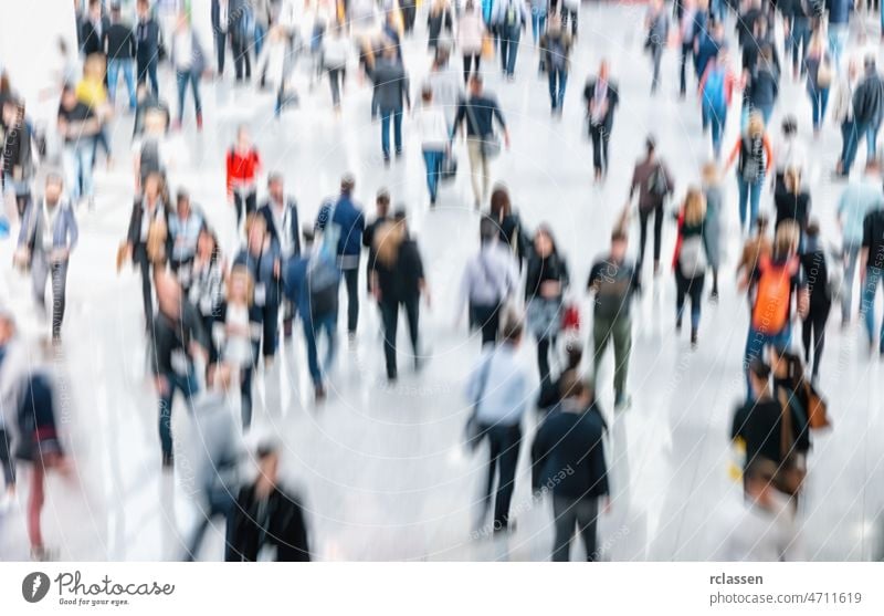 blurred people in a modern hall crowd commute convention business airport booth sale congress anonymous conference banner commercial commuters crowded economy