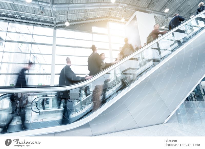 Blurred  business people using a skywalk/staircase architecture visitors moving london corridor frankfurt trade fair dusseldorf group cologne blur germany messe