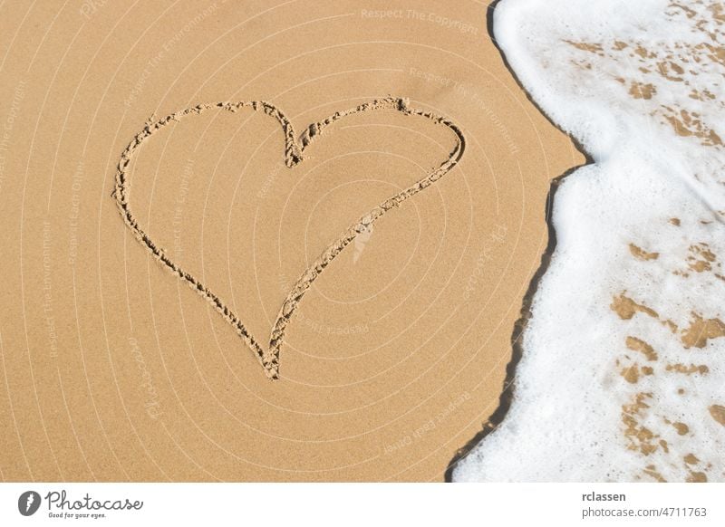 Heart drawn on the beach sand with sea foam and wave domburg netherlands zeeland holland dutch europe sylt holidays tide water coastal waves travel vacation