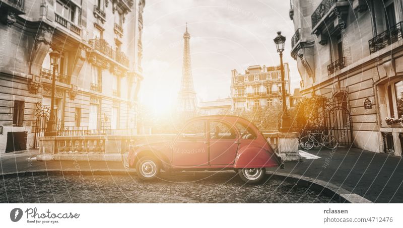 Eiffel Tower in Paris and retro red car at the  Avenue de Camoens eiffel tower paris city romantic french sunshine attraction eifel street duck alley europe