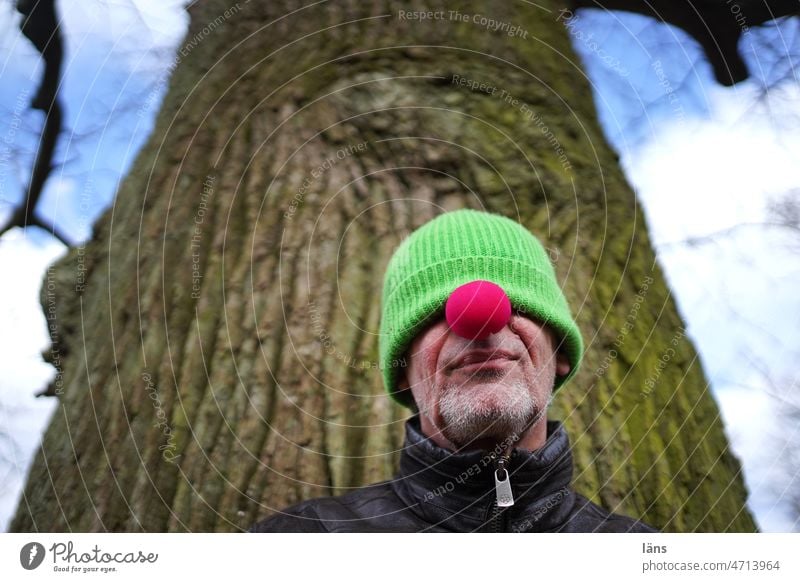 Clown in pause mode Man with cap red nose Break see nothing submerged Cap Human being Colour photo Nose portrait Masculine Head Withdrawn Retreat retreat