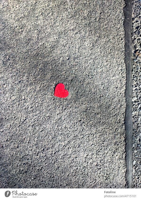I just couldn't walk past this little red heart on the drab, gray asphalt. Heart Red Love Heart-shaped Paper Street Sign Close-up Declaration of love