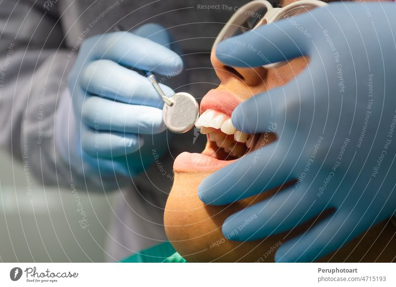 A young patient attends a dental examination at the dentist's office. care Career Dentist cary tooth Woman Caucasian Chair clinic concept make good Clean