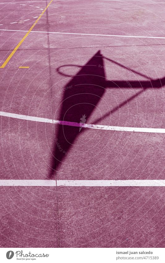 silhouette on the pink street basket court basketball hoop shadow sunlight ground field floor sport equipment game competition play playing abandoned park