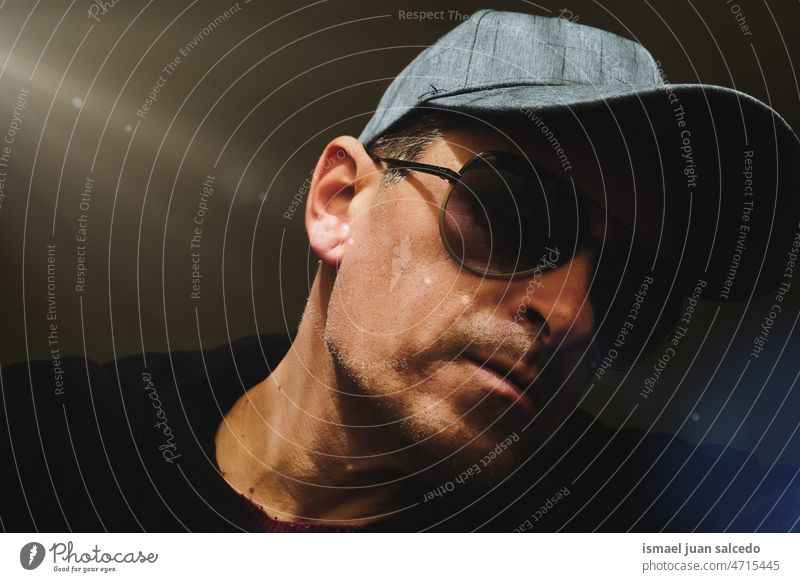 man with a cap and sunglasses taking a selfie one person portrait forty forties face head adult man male 40 years daytime casual style free time lifestyle