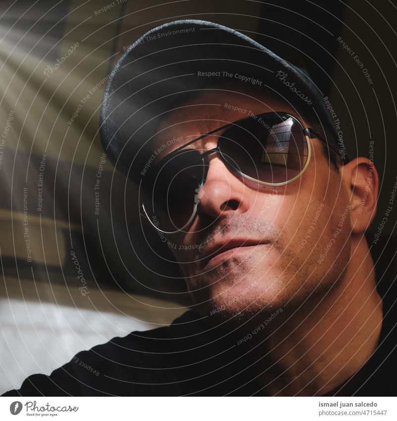 adult man with sunglasses and cap taking a selfie one person portrait forty forties face head male 40 years daytime casual style free time lifestyle nature