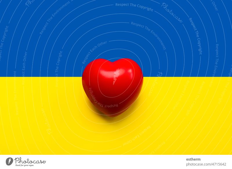 National flag of Ukraine background with a red heart. Donation concept independence government world state europe war Russia peace diplomacy donation help aid