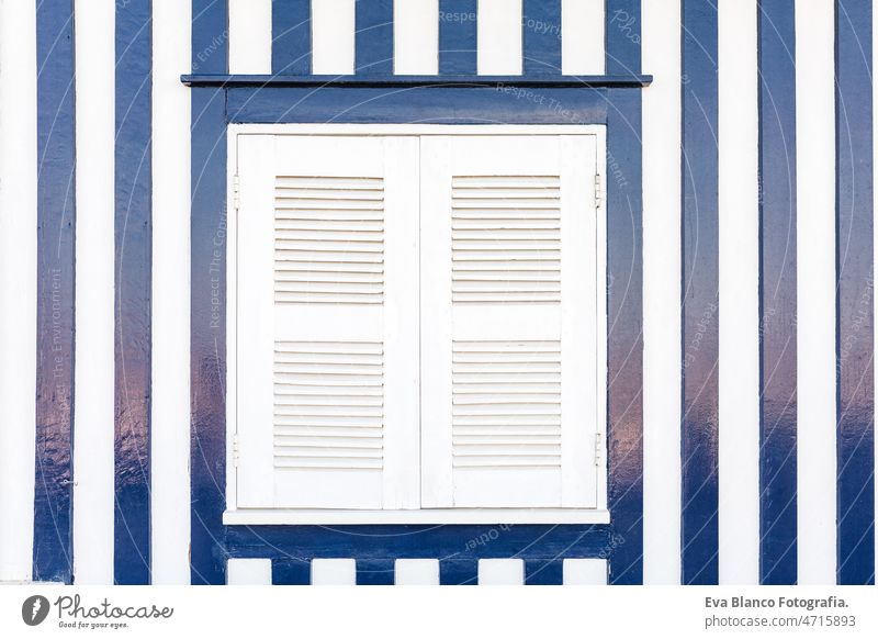 Detail of typical facade of Aveiro, white window over blue stripped wall.Costa Nova, Aveiro,Portugal houses portugal aveiro costa nova colorful travel nobody