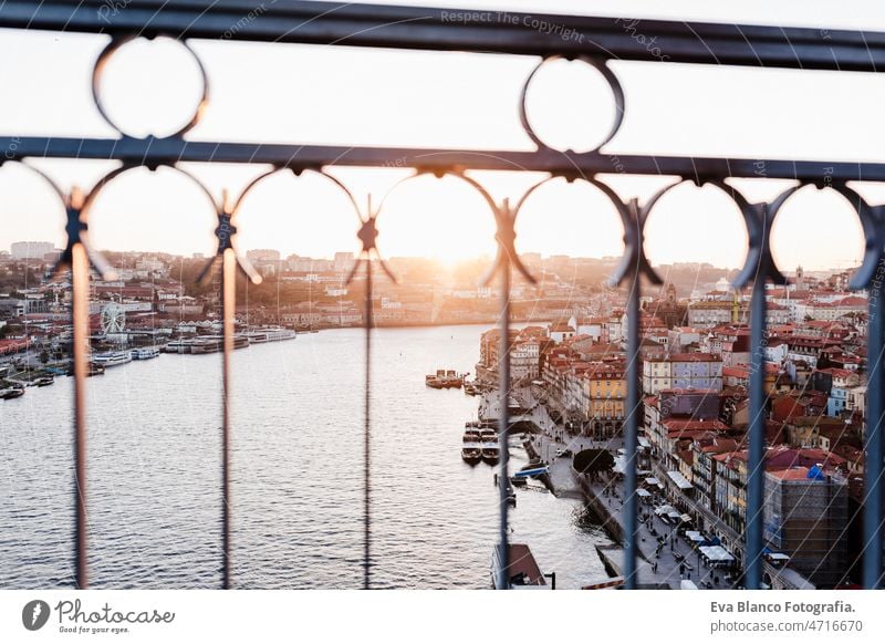 railing on Porto bridge at sunset, selective focus on city. Travel, Europe porto urban travel portugal nobody traveler river douro panorama girl ancient