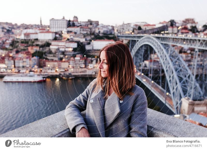 young relaxed woman in Porto bridge at sunset. Tourism in city Europe. travel and lifestyle porto tourist enjoy 30s holidays vacation urban high portuguese